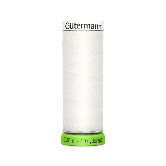 A spool of Gutermann Sew-all rPET 100m thread in white color, indicating the length and quality of the thread.