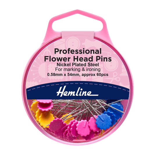Pink container of Hemline flower head pins with colorful flower heads on a white background