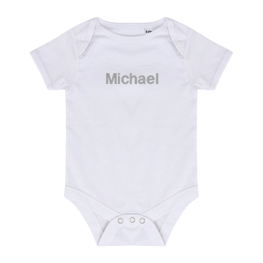 white baby bodysuit with silver embroidered name