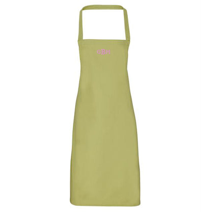Green apron with pink text on a white background
