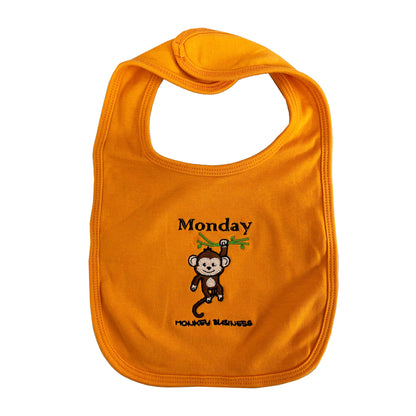 Orange bib with a monkey design and 'Monday' text 