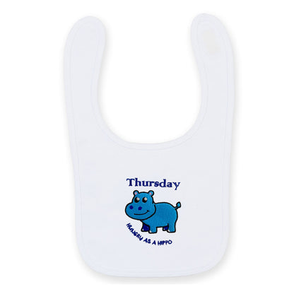 White bib with blue hippo design and text 