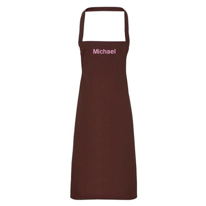 Brown apron with 'Michael' embroidered on a white background