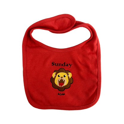 Red bib with a lion graphic and 'Sunday' text on a white background