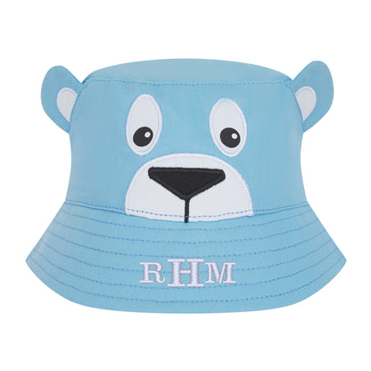 Blue children's bucket hat with bear face design and 'RHM' initials on a white background