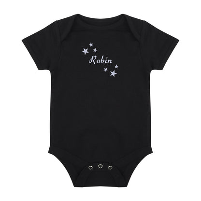 A black short-sleeve baby bodysuit with the name 'Robin' and small white stars embroidered on the chest, displayed flat against a solid white background.