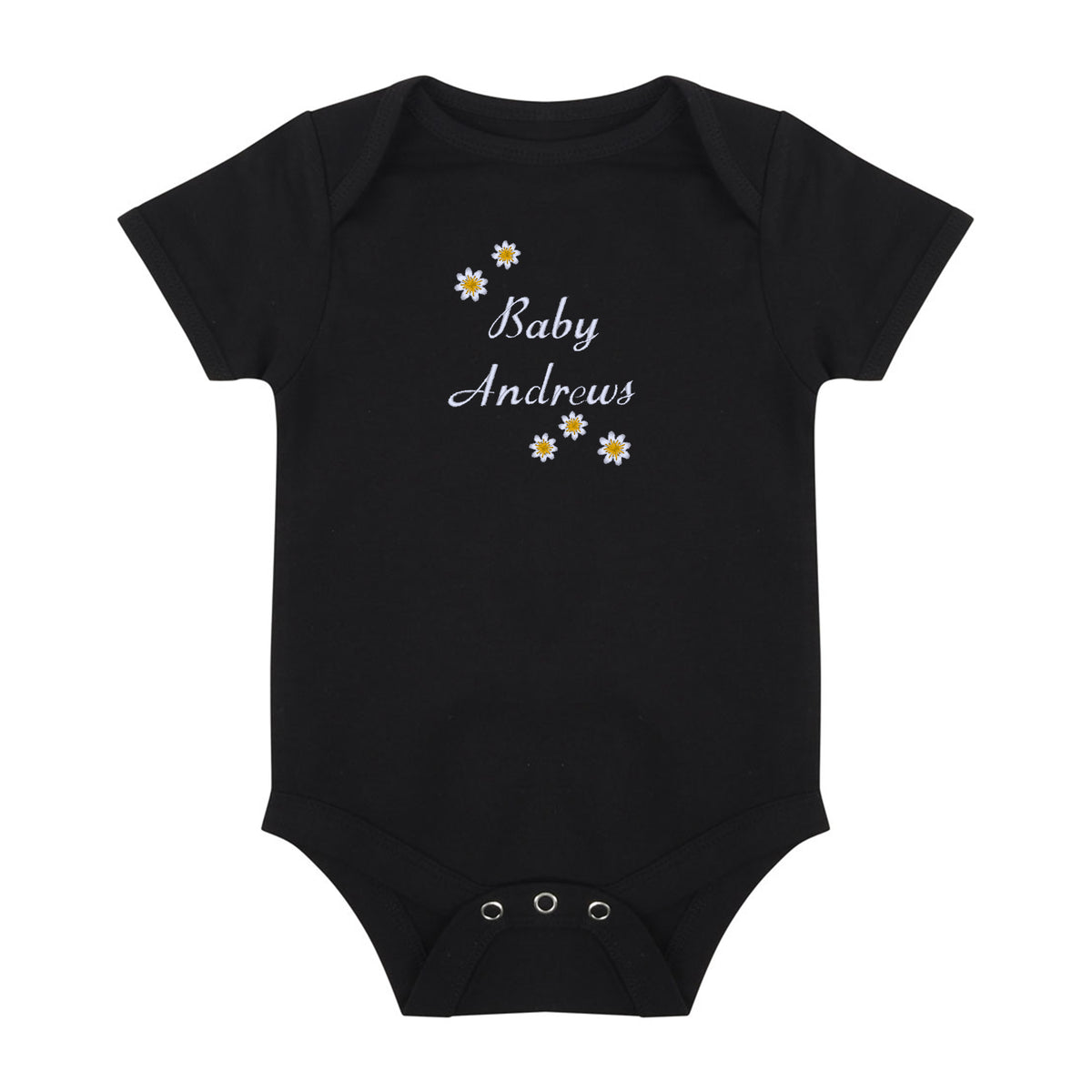 A black short-sleeve baby bodysuit with 'Baby Andrews' embroidered in white script on the chest, decorated with small white and yellow daisy flowers. The bodysuit has three silver metal snap buttons at the crotch and is displayed flat against a solid white background.