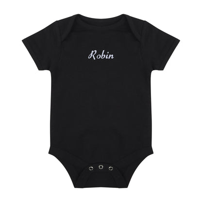 A black short-sleeve baby bodysuit with the name 'Robin' embroidered in white cursive script across the chest, displayed flat against a solid white background.