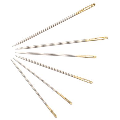 Set of gold and silver needles on a white background