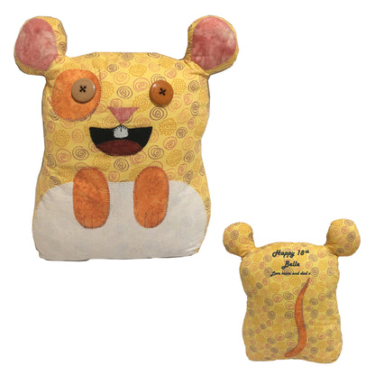 Handmade yellow toy with pink ears and orange accents on a white background