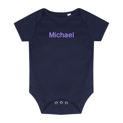 navy baby bodysuit with a lilac embroidered name 