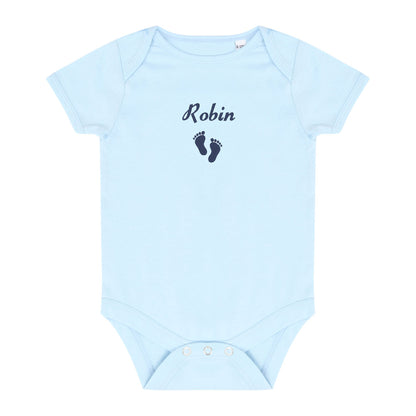 A light blue baby short-sleeve bodysuit with 'Robin' and a pair of dark blue baby feet embroidered on the chest, displayed flat against a white background.