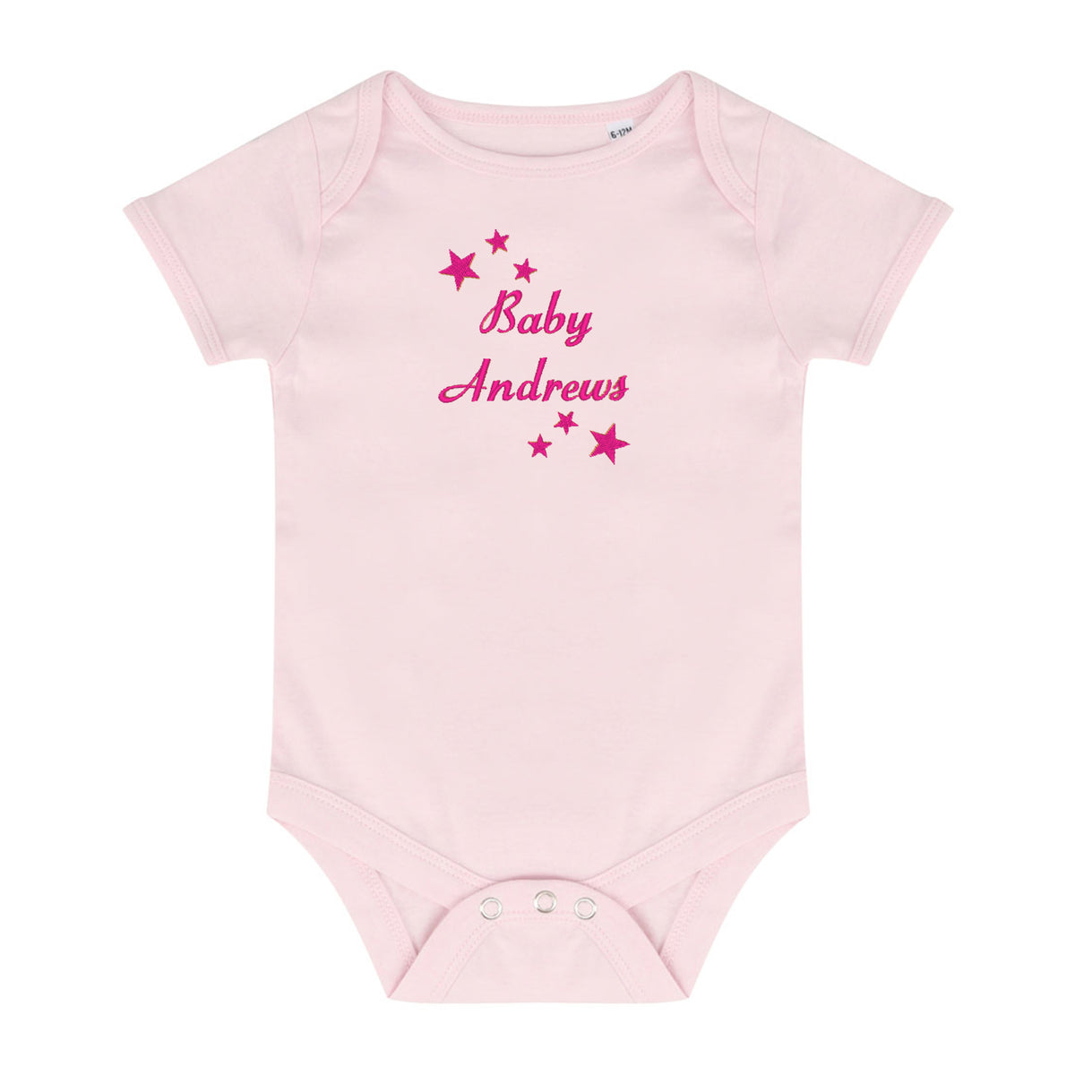 A light pink short-sleeve baby bodysuit with 'Baby Andrews' embroidered in dark pink script across the chest, surrounded by small pink stars, shown on a plain white background.