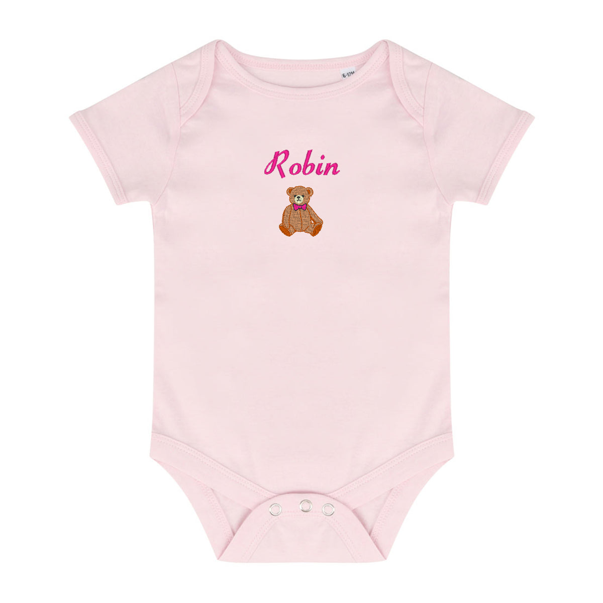 A light pink short-sleeve baby bodysuit with a custom name 'Robin' in pink script and a small brown teddy bear graphic on the chest, displayed on a solid white background.