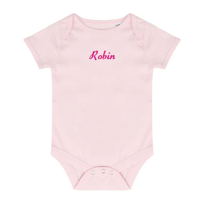 A light pink short-sleeve baby bodysuit with the name 'Robin' embroidered in pink cursive across the chest, displayed on a solid white background.