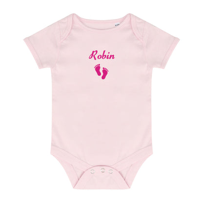 A light pink short-sleeve baby bodysuit with 'Robin' and baby feet embroidered in dark pink on the chest, displayed flat against a white background.