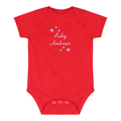 A red short-sleeve baby bodysuit with 'Baby Andrews' and small white stars embroidered on the chest, displayed flat against a white background.