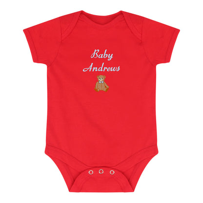 A red short-sleeve baby bodysuit with 'Baby Andrews' embroidered in white script and a small teddy bear graphic on the chest, shown on a plain white background.