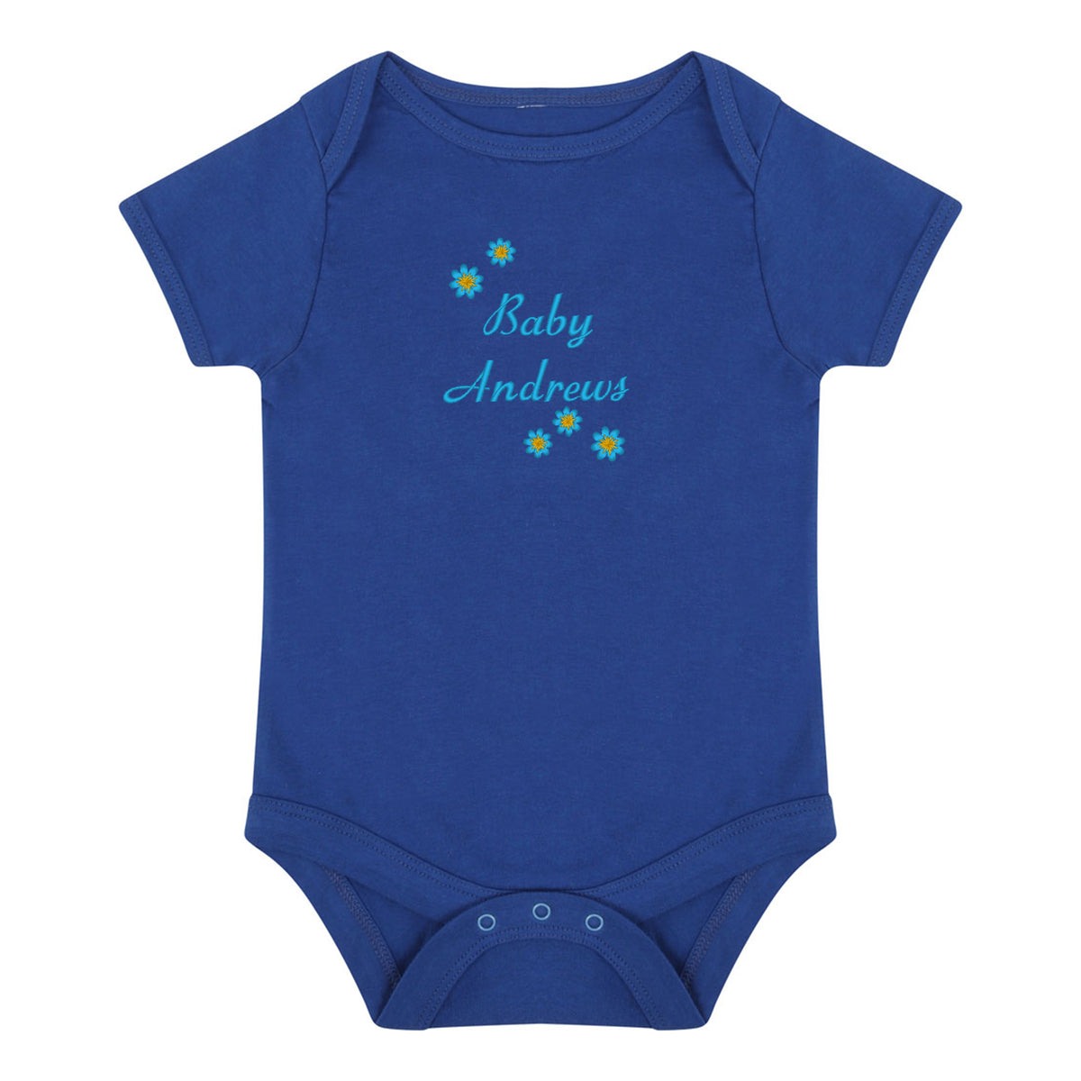 A royal blue short-sleeve baby bodysuit with 'Baby Andrews' embroidered in light blue script on the chest, decorated with small yellow and blue flower graphics, shown on a plain white background.