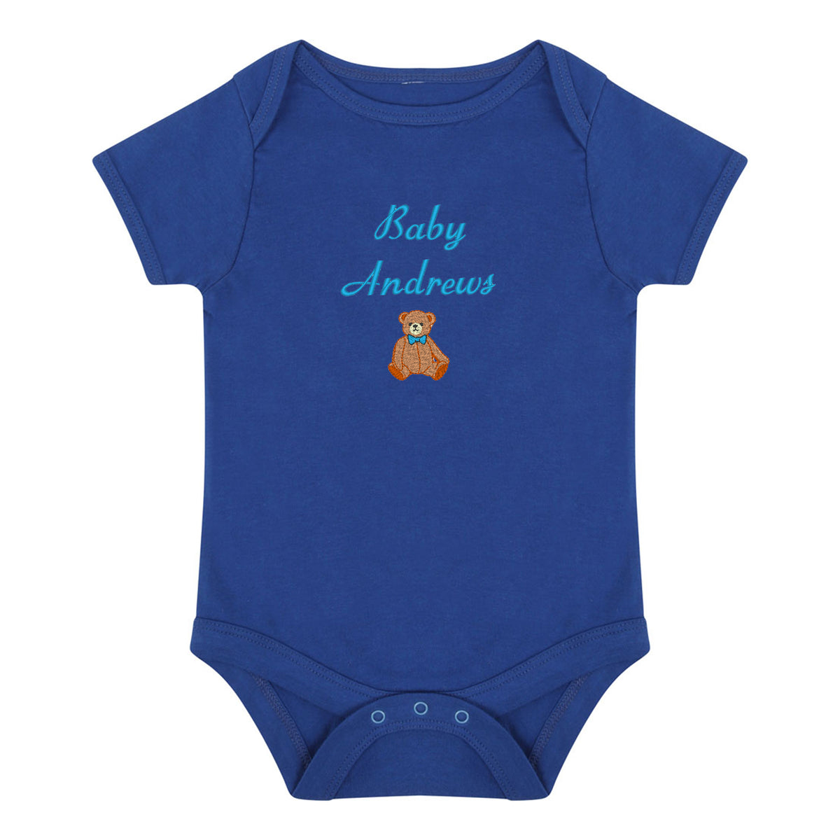 A royal blue short-sleeve baby bodysuit with 'Baby Andrews' embroidered in light blue script above a small brown teddy bear wearing a blue bow tie, shown on a plain white background.