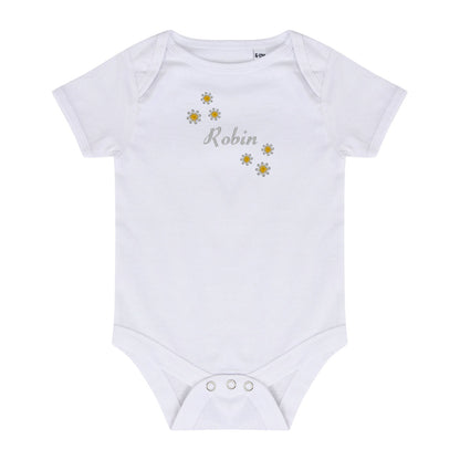 A white short-sleeve baby bodysuit with three silver snap buttons at the crotch. The chest features a graphic of five yellow and white daisy flowers with the name 'Robin' written in a gray cursive font in the center.