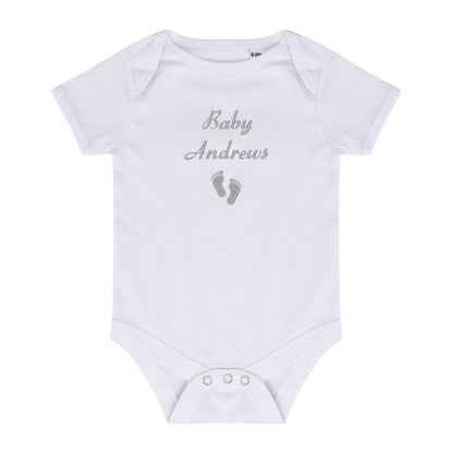 A white short-sleeve baby bodysuit with 'Baby Andrews' and baby footprints embroidered in gray on the chest, displayed flat against a white background.
