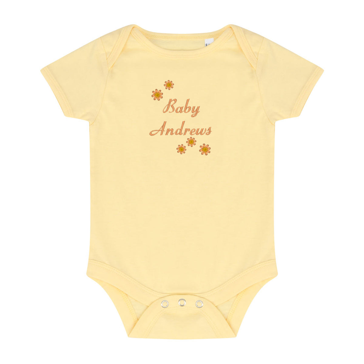 A pale yellow short-sleeve baby bodysuit with 'Baby Andrews' embroidered in a warm brown script font, accented by small brown flower graphics, shown on a plain white background.