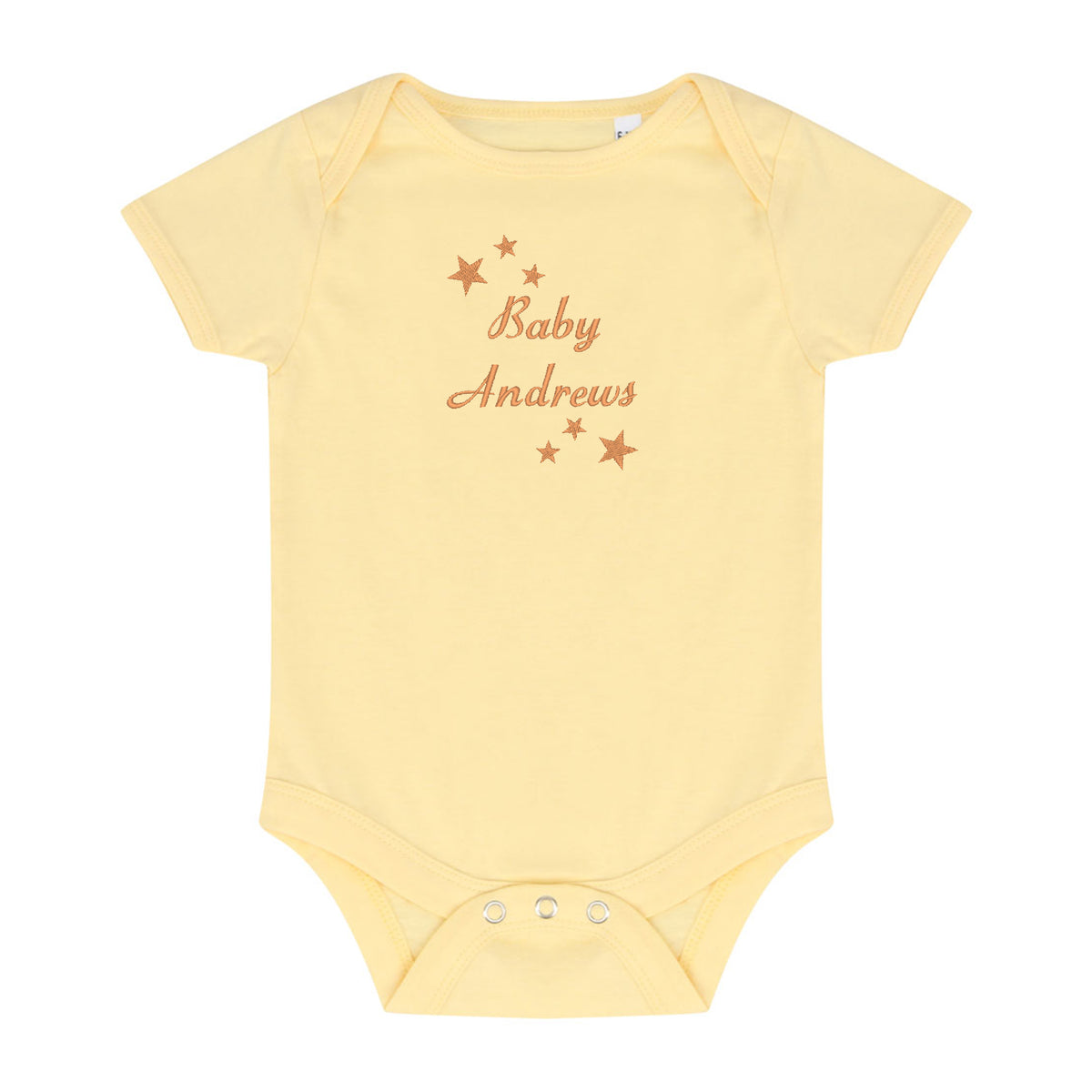 A pale yellow short-sleeve baby bodysuit with 'Baby Andrews' and small stars embroidered in a warm brownish-orange color on the chest, displayed flat against a white background.